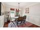 Cozy dining room with modern chandelier, natural light, and stylish decor accents at 2191 Greencroft St, Carmel, IN 46032