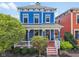 Charming blue two-story home with a welcoming front porch and well-manicured landscaping at 2191 Greencroft St, Carmel, IN 46032
