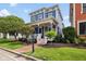 Beautiful home featuring a well-manicured lawn, brick walkway, and inviting front porch at 2191 Greencroft St, Carmel, IN 46032