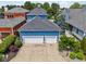 Aerial view of a two-car garage with ample driveway space and mature landscaping at 2191 Greencroft St, Carmel, IN 46032