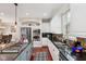 Modern kitchen featuring stainless steel appliances, granite countertops, and mosaic tile backsplash at 2191 Greencroft St, Carmel, IN 46032