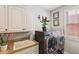 Functional laundry room with white cabinets, front load washer/dryer and ample counter space at 2191 Greencroft St, Carmel, IN 46032