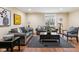 Cozy living room with plush seating, a dark rug, and a decorative coffee table, creating an inviting space at 2191 Greencroft St, Carmel, IN 46032
