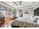 Bedroom with hardwood floors, lots of sunlight and a bed covered with a white blanket at 2191 Greencroft St, Carmel, IN 46032