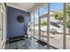 Inviting screened-in porch with blue walls, white trim, and a view of outdoor seating at 2191 Greencroft St, Carmel, IN 46032