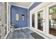 Charming screened-in porch with blue walls, white trim, and neutral flooring, accessible through glass doors at 2191 Greencroft St, Carmel, IN 46032