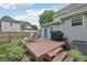 The backyard features a well-maintained deck with lounge chairs and a grill, perfect for relaxing and entertaining at 2229 N Arsenal Ave, Indianapolis, IN 46218