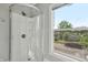 Bright bathroom showcases a modern shower, window, and white trim at 2229 N Arsenal Ave, Indianapolis, IN 46218