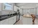 Updated kitchen featuring stainless steel appliances, granite countertops, and a butcher block island at 2229 N Arsenal Ave, Indianapolis, IN 46218