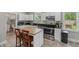 Modern kitchen with stainless steel appliances, dark countertops, and a butcher block island at 2229 N Arsenal Ave, Indianapolis, IN 46218