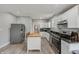 Well-equipped kitchen with granite countertops, stainless steel appliances and access to dining and bath at 2229 N Arsenal Ave, Indianapolis, IN 46218