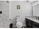 Clean bathroom with marble-look tiled shower and modern black hardware and vanity at 2309 Alexandria Dr, Greenfield, IN 46140