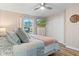 Comfortable bedroom with neutral colors, wood floors, and a wall-mounted TV for relaxed living at 2309 Alexandria Dr, Greenfield, IN 46140