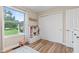 Bright bedroom features a large window, wood floors, and built-in storage for an organized and playful space at 2309 Alexandria Dr, Greenfield, IN 46140