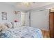 A cozy bedroom features wood floors, closet, and natural light at 2309 Alexandria Dr, Greenfield, IN 46140
