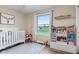 Inviting Bedroom featuring natural light, wood floors, and charming decor for a cozy and peaceful space at 2309 Alexandria Dr, Greenfield, IN 46140