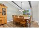 Inviting dining room with a large wooden table, chairs, a charming chandelier, and natural light streaming through the windows at 2309 Alexandria Dr, Greenfield, IN 46140