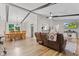 An open-concept living room combines dining and seating areas with hardwood floors at 2309 Alexandria Dr, Greenfield, IN 46140