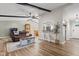 Open living room showcases hardwood floors, exposed beams, and a pass-through to the kitchen at 2309 Alexandria Dr, Greenfield, IN 46140