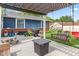 Relaxing outdoor patio features a pergola, seating, grill, and plenty of space for entertaining at 2309 Alexandria Dr, Greenfield, IN 46140