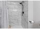 Bright shower with marble-look tile, a modern showerhead, and a sleek design for a spa-like experience at 2309 Alexandria Dr, Greenfield, IN 46140