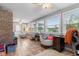 Bright sunroom featuring many windows, ceiling fan, and plenty of space for various activities and decor at 2309 Alexandria Dr, Greenfield, IN 46140
