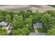 Aerial view of property showcasing lush greenery, nearby fields, and the home's location in a serene setting at 2397 Lincoln Dr, Cicero, IN 46034