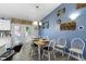 Cozy dining area features a table for six and a nearby door to the exterior patio at 2397 Lincoln Dr, Cicero, IN 46034
