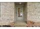 Close-up of front door surrounded by brickwork and decorative elements at 2397 Lincoln Dr, Cicero, IN 46034