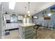 Bright kitchen with white cabinets, breakfast bar, and natural light from the skylight at 2397 Lincoln Dr, Cicero, IN 46034