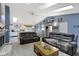 Open-concept living room with modern decor, skylights, and seamless flow to the kitchen and dining areas at 2397 Lincoln Dr, Cicero, IN 46034