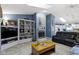 Cozy living room with a fireplace, skylights, and an open view into the kitchen at 2397 Lincoln Dr, Cicero, IN 46034