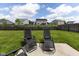 Private fenced backyard featuring a concrete patio with lounge chairs and a great view of the neighborhood at 2717 Arklow Way, Brownsburg, IN 46112
