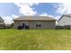 Wide backyard with a grassy yard, an outdoor patio, and plenty of space for relaxing at 2717 Arklow Way, Brownsburg, IN 46112