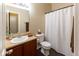 Well-maintained bathroom with vanity, sink, toilet, and shower with white shower curtain at 2717 Arklow Way, Brownsburg, IN 46112