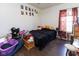 This bedroom offers wood flooring, window for natural light and cozy decor at 2717 Arklow Way, Brownsburg, IN 46112