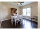 Bright dining room with a wooden hutch, a classic table setting, and a large window at 2717 Arklow Way, Brownsburg, IN 46112
