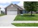 Charming single-story home featuring a front-facing garage, brick accents, and a well-manicured lawn at 2717 Arklow Way, Brownsburg, IN 46112
