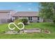 Well-maintained backyard with lush green grass and mature plants at 2911 W Hawanian Ln, Monrovia, IN 46157