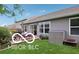 Rear exterior view of the home showing a patio, storage shed, and well-maintained yard with mature plantings at 2911 W Hawanian Ln, Monrovia, IN 46157