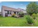 Landscaped backyard offers a patio area, lush lawn, and home exterior view at 2911 W Hawanian Ln, Monrovia, IN 46157