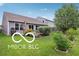 Landscaped backyard featuring a lush lawn and mature trees, perfect for outdoor enjoyment at 2911 W Hawanian Ln, Monrovia, IN 46157