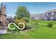 Well-manicured backyard with lush landscaping, a manicured lawn, and a privacy fence enclosing the space at 2911 W Hawanian Ln, Monrovia, IN 46157