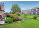 Beautiful backyard with lush landscaping, green grass, and a cozy patio area at 2911 W Hawanian Ln, Monrovia, IN 46157