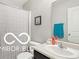 Well-lit bathroom with a shower curtain and a vanity with a sink at 2911 W Hawanian Ln, Monrovia, IN 46157