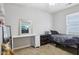 Well-lit bedroom featuring a comfortable bed and a desk, creating a relaxing and functional space at 2911 W Hawanian Ln, Monrovia, IN 46157