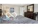 Serene bedroom featuring a well-dressed bed, dresser, and mirror at 2911 W Hawanian Ln, Monrovia, IN 46157