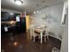 A cozy dining area featuring dark hardwood floors and a chandelier at 2911 W Hawanian Ln, Monrovia, IN 46157
