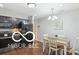 Cozy dining area adjacent to the kitchen, featuring a wooden table and modern lighting at 2911 W Hawanian Ln, Monrovia, IN 46157