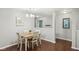 Cozy dining room featuring hardwood floors, a modern chandelier, and lots of natural light at 2911 W Hawanian Ln, Monrovia, IN 46157